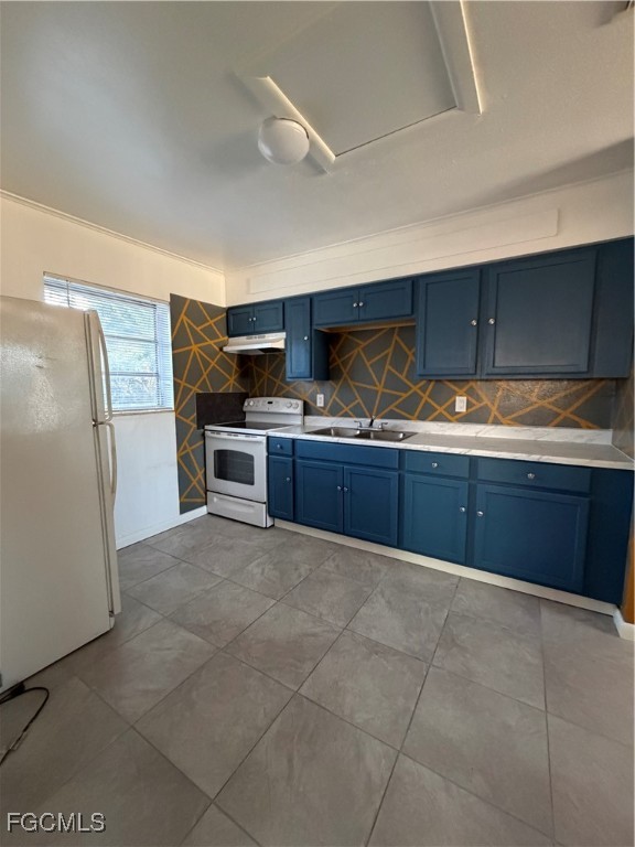 1126 Florida Avenue Clewiston, FL 33440 - Photo 5 of 13 a kitchen with stainless steel appliances granite countertop a refrigerator and a sink