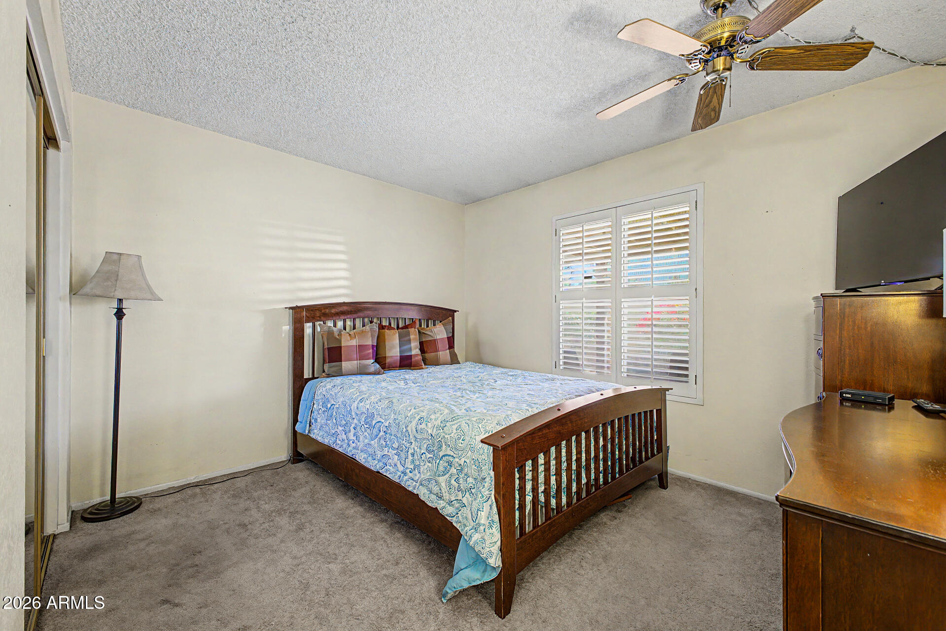 2659 West Hearn Road Phoenix, AZ 85023 - Photo 18 of 25 a bedroom with a bed and a flat screen tv