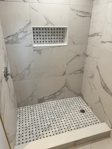 a view of a hallway with washer and dryer