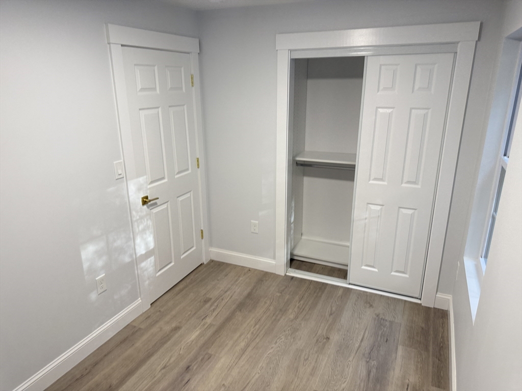 27 Leicester Street, Unit 1 Oxford, MA 01537 - Photo 19 of 26 a view of empty room with wooden floor
