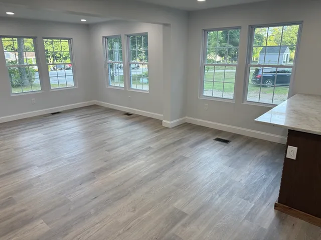 a utility room with cabinets washer and dryer