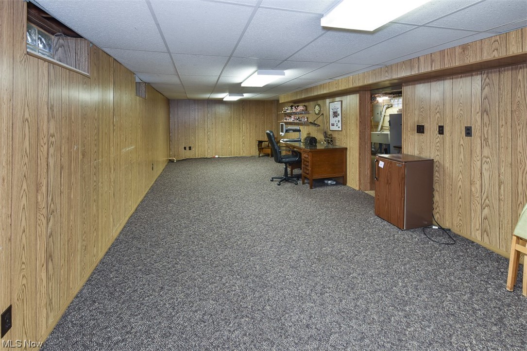 4026 Stonehaven Road Cleveland, OH 44121 - Photo 26 of 30 Office area with dark carpet, a paneled ceiling, and wooden walls