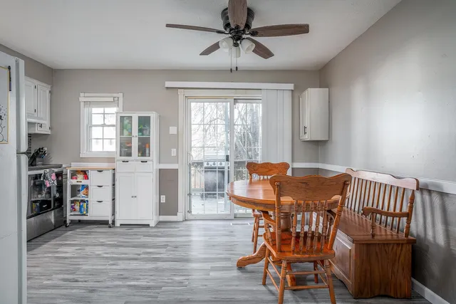 a view of a dining room with furniture and window