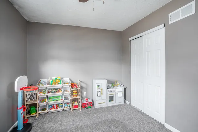 a bedroom with furniture and a window