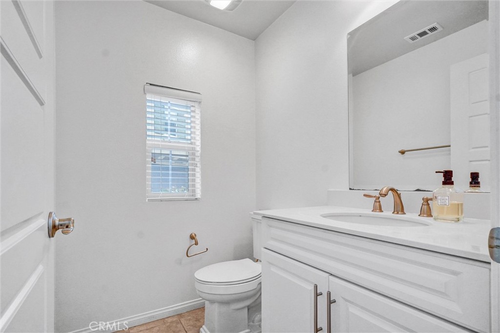 54 Visionary Irvine, CA 92618 - Photo 15 of 39 a bathroom with a sink toilet and a mirror