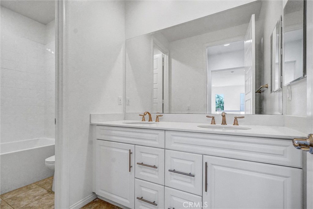 54 Visionary Irvine, CA 92618 - Photo 23 of 39 a bathroom with a sink and a mirror