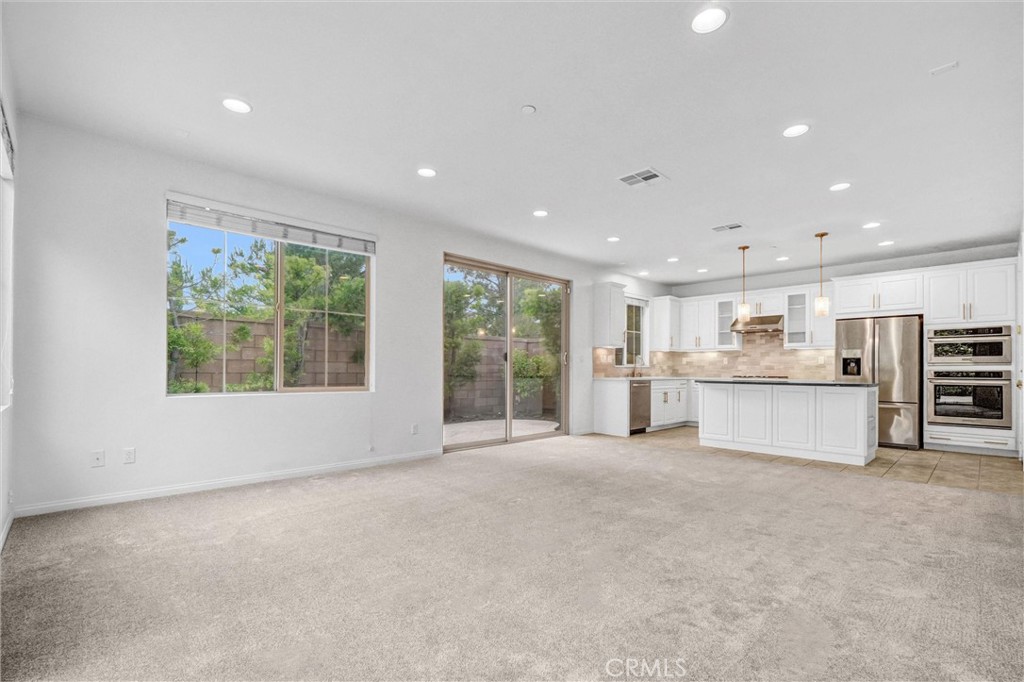54 Visionary Irvine, CA 92618 - Photo 7 of 39 a view of an empty room with a stove and a large window