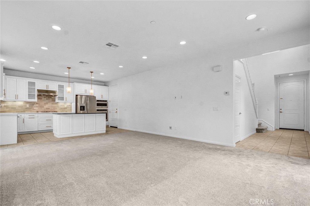 54 Visionary Irvine, CA 92618 - Photo 8 of 39 a view of kitchen with refrigerator and kitchen island