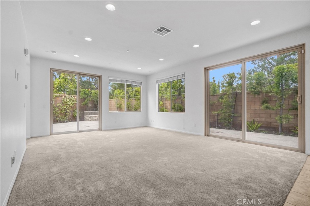 54 Visionary Irvine, CA 92618 - Photo 9 of 39 a view of an empty room with wooden floor and a window