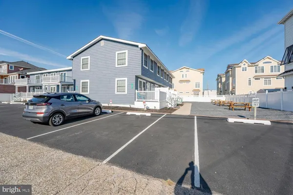 a view of a car parked in front of a building