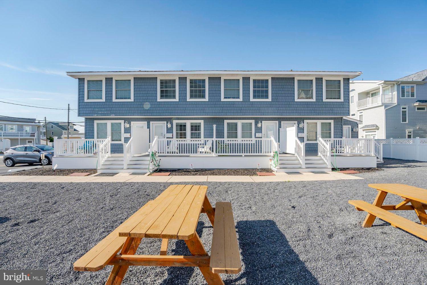 229 10th Street North, Unit 2 Brigantine, NJ 08203 - Photo 17 of 24 a front view of a house with swimming pool