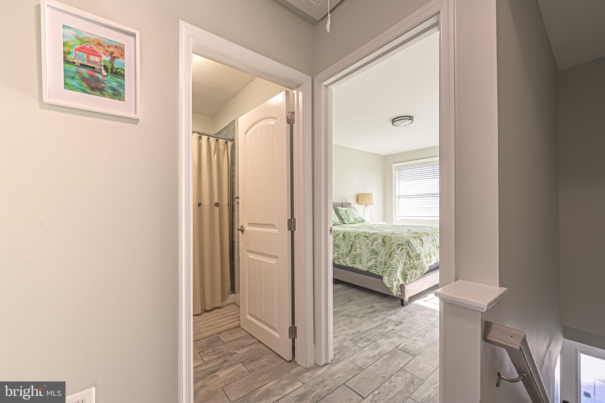 229 10th Street North, Unit 2 Brigantine, NJ 08203 - Photo 10 of 24 a view of a hallway and a livingroom with furniture