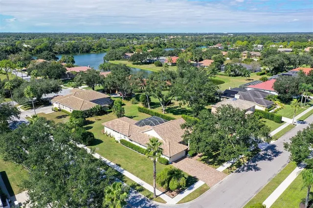a living room with lots of furniture and kitchen view