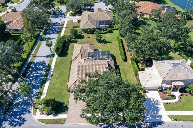 a living room with furniture a large window and a flat screen tv