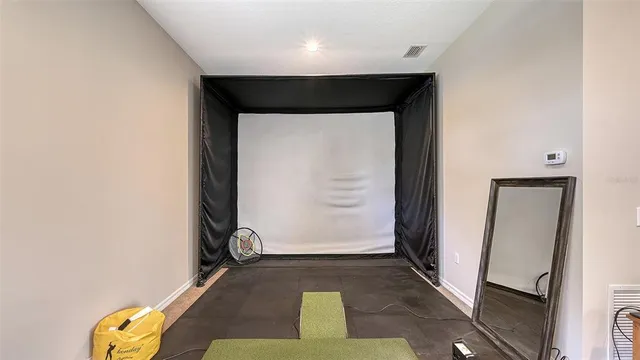 a view of a chairs and table in the patio