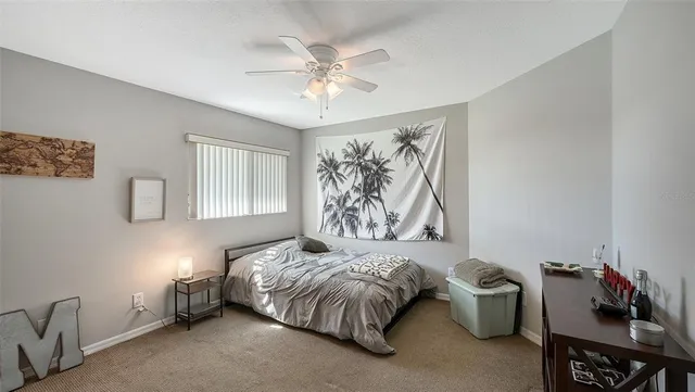a view of a patio with table and chairs under an umbrella