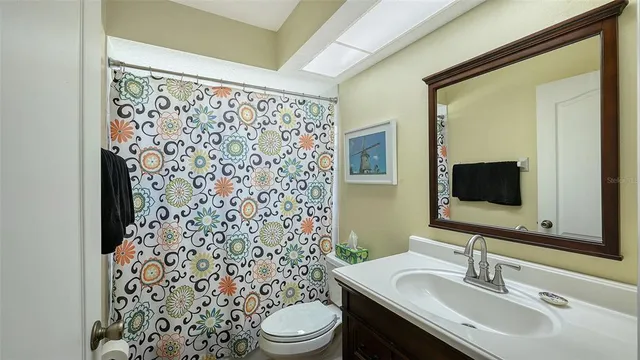 a swimming pool with barbeque oven and outdoor seating