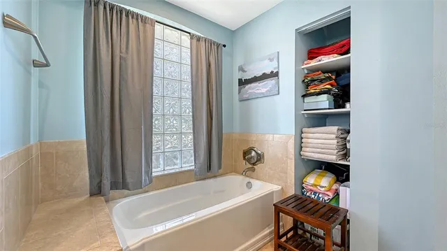 an aerial view of a residential houses with outdoor space and street view