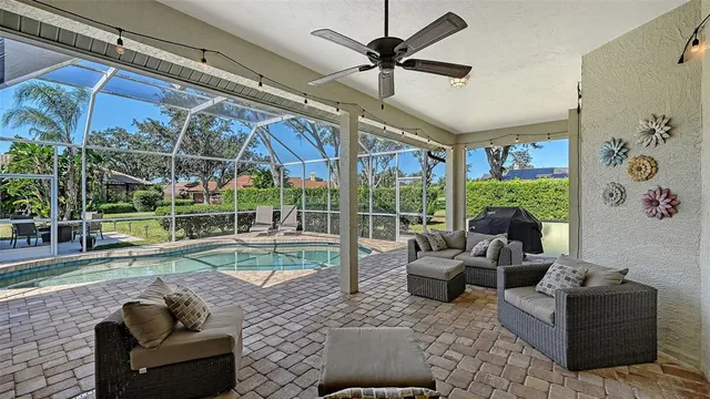 an aerial view of lake residential house with swimming pool and green space