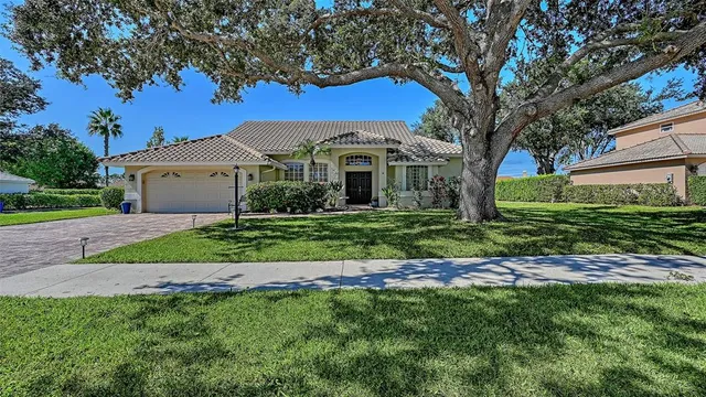 an aerial view of lake residential houses with outdoor space and seating