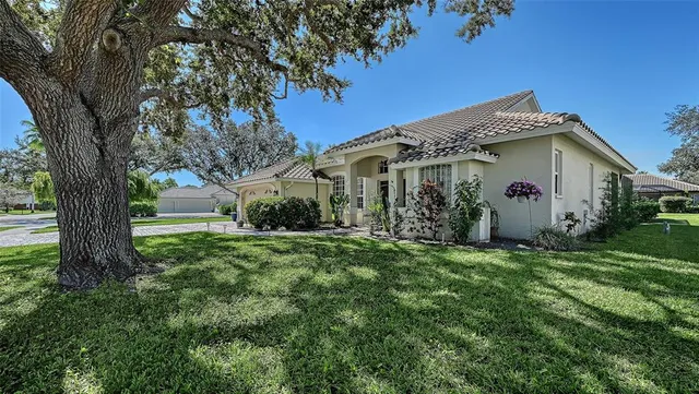 an aerial view of residential house with outdoor space and swimming pool