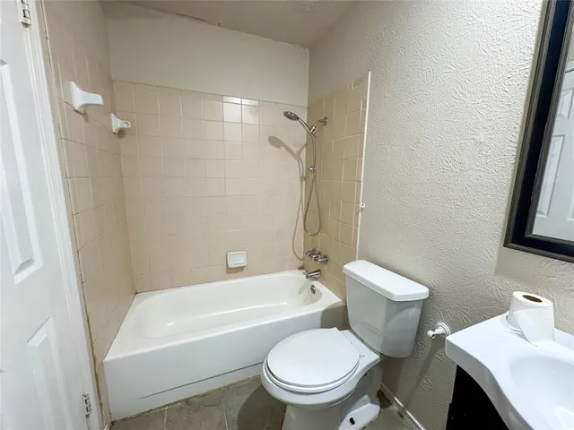 a view of a hallway with chandelier and entryway