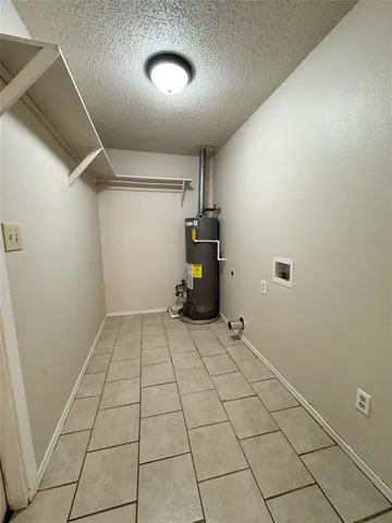 a kitchen with a sink cabinets and a window