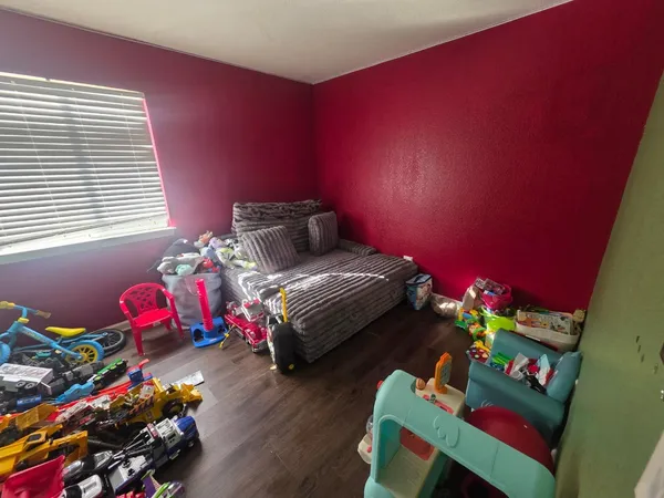 a bedroom with furniture and a bed