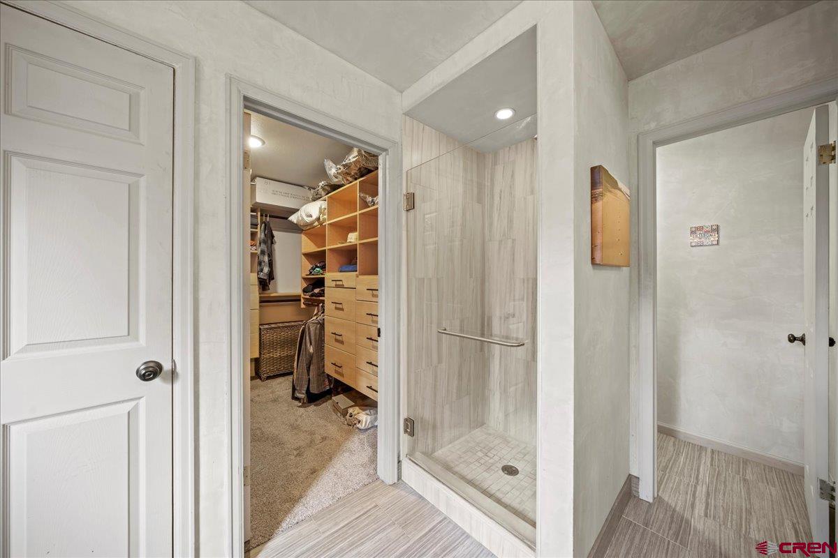1010 Canyon Drive Ridgway, CO 81432 - Photo 17 of 37 a view of a bathroom with a glass shower door