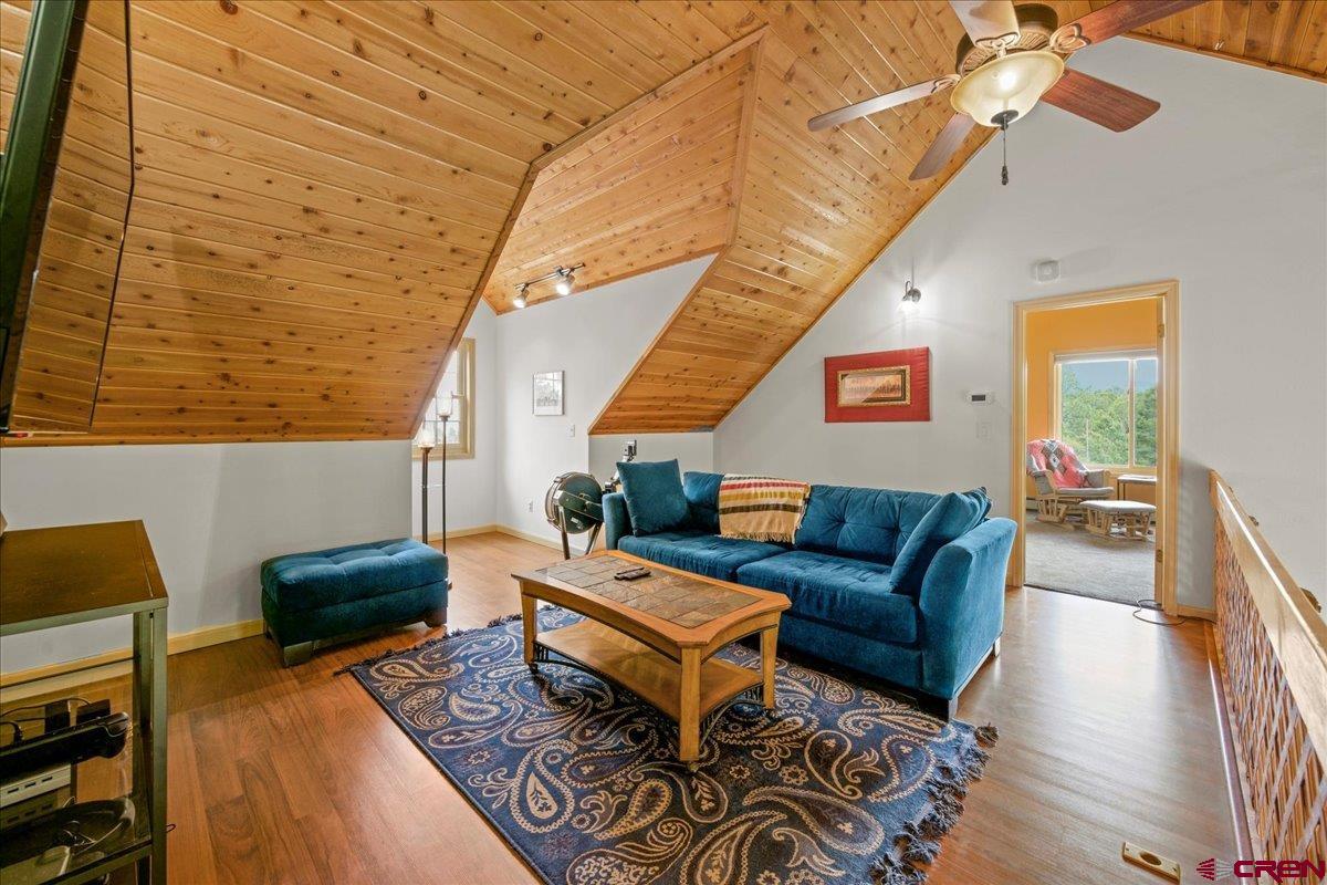 1010 Canyon Drive Ridgway, CO 81432 - Photo 22 of 38 a living room with furniture and a wooden floor