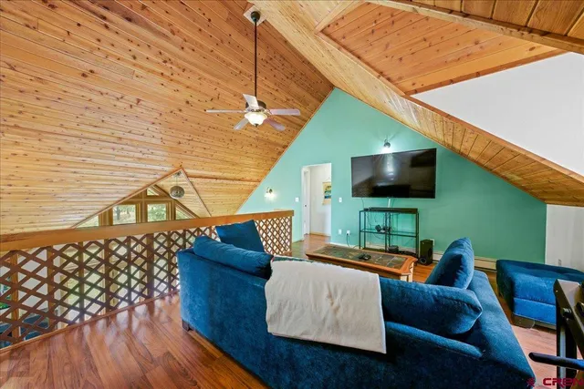 a outdoor living space with furniture and a flat screen tv