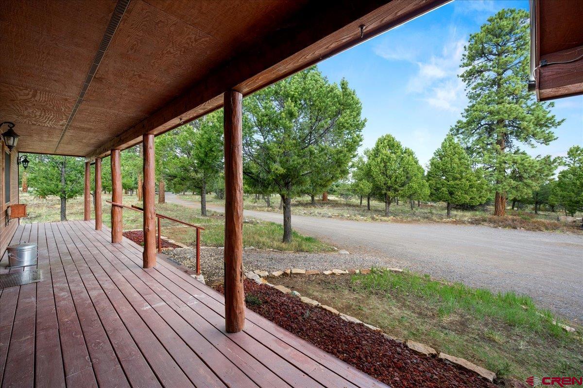 1010 Canyon Drive Ridgway, CO 81432 - Photo 3 of 37 a view of a deck with wooden floor and outdoor space