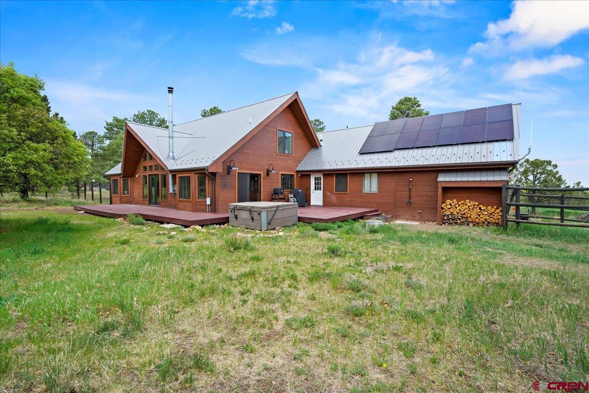 1010 Canyon Drive Ridgway, CO 81432 - Photo 33 of 38 a front view of a house with a garden