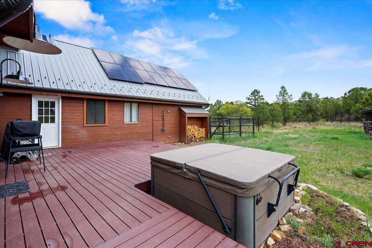 1010 Canyon Drive Ridgway, CO 81432 - Photo 34 of 38 a table and chairs sitting in front of a house