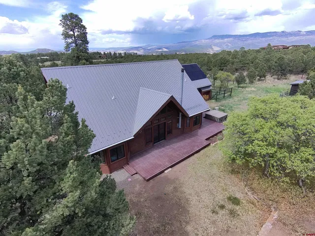 a terrace of a house with outdoor seating