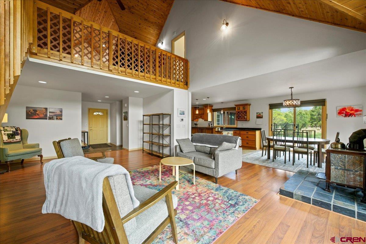 1010 Canyon Drive Ridgway, CO 81432 - Photo 9 of 38 a living room with furniture and a wooden floor