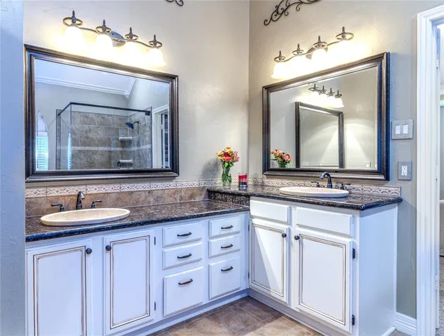 a view of bathroom with dual sinks