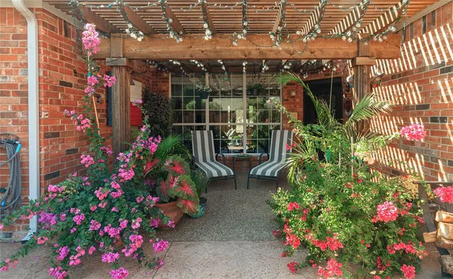 a view of street with lots of flowers and flowers