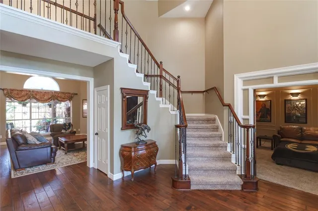 a view of entryway livingroom and hall with wooden floor