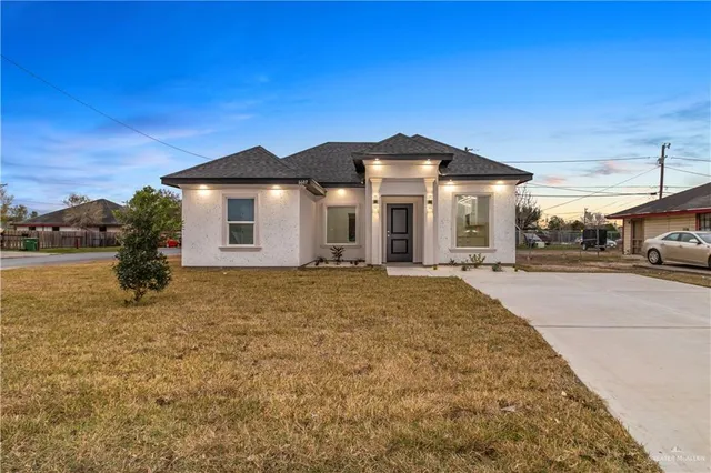 a front view of a house with a yard