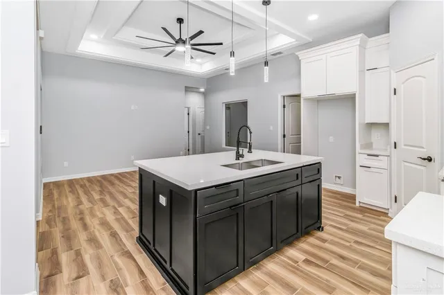 a kitchen with a sink and a refrigerator