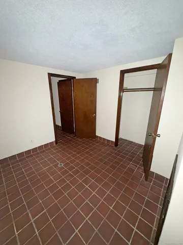 an empty room with wooden floor