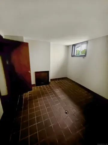 a bedroom with a bed and a mirror