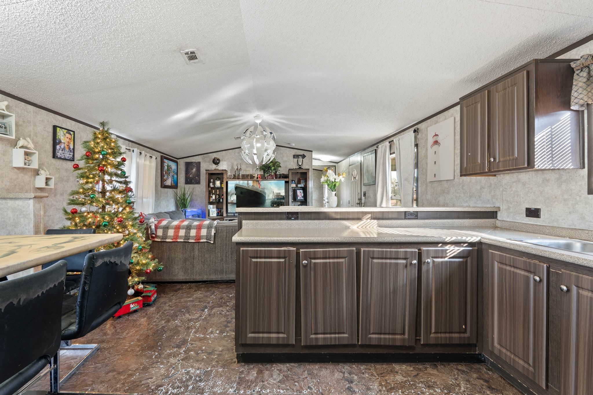 14633 Forest Tower Court Conroe, TX 77306 - Photo 11 of 25 a kitchen with a sink stove and cabinets