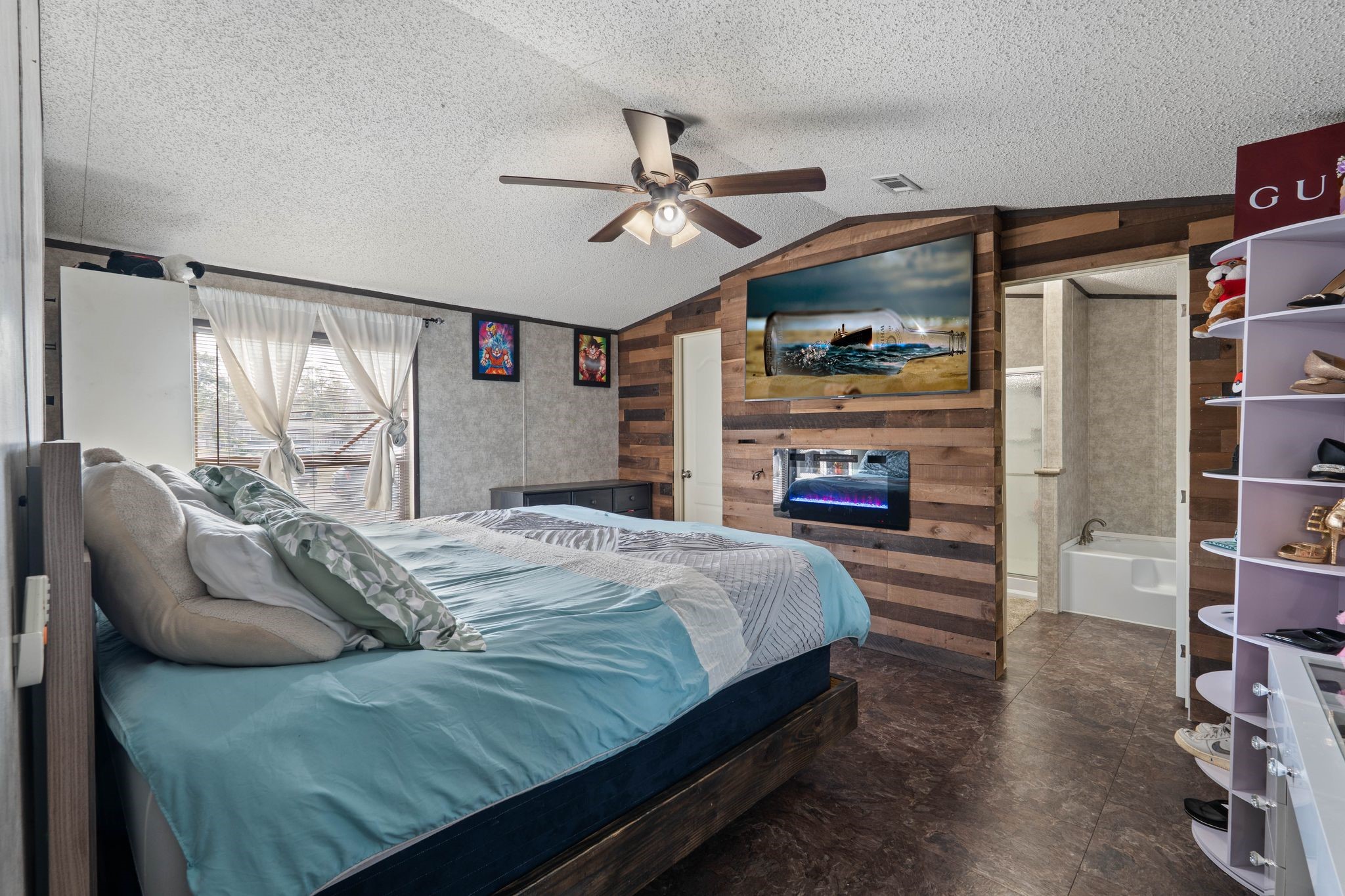 14633 Forest Tower Court Conroe, TX 77306 - Photo 12 of 25 a bedroom with a bed and a walk in closet