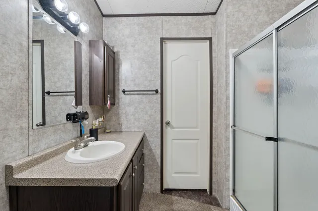 a bathroom with a sink and a mirror