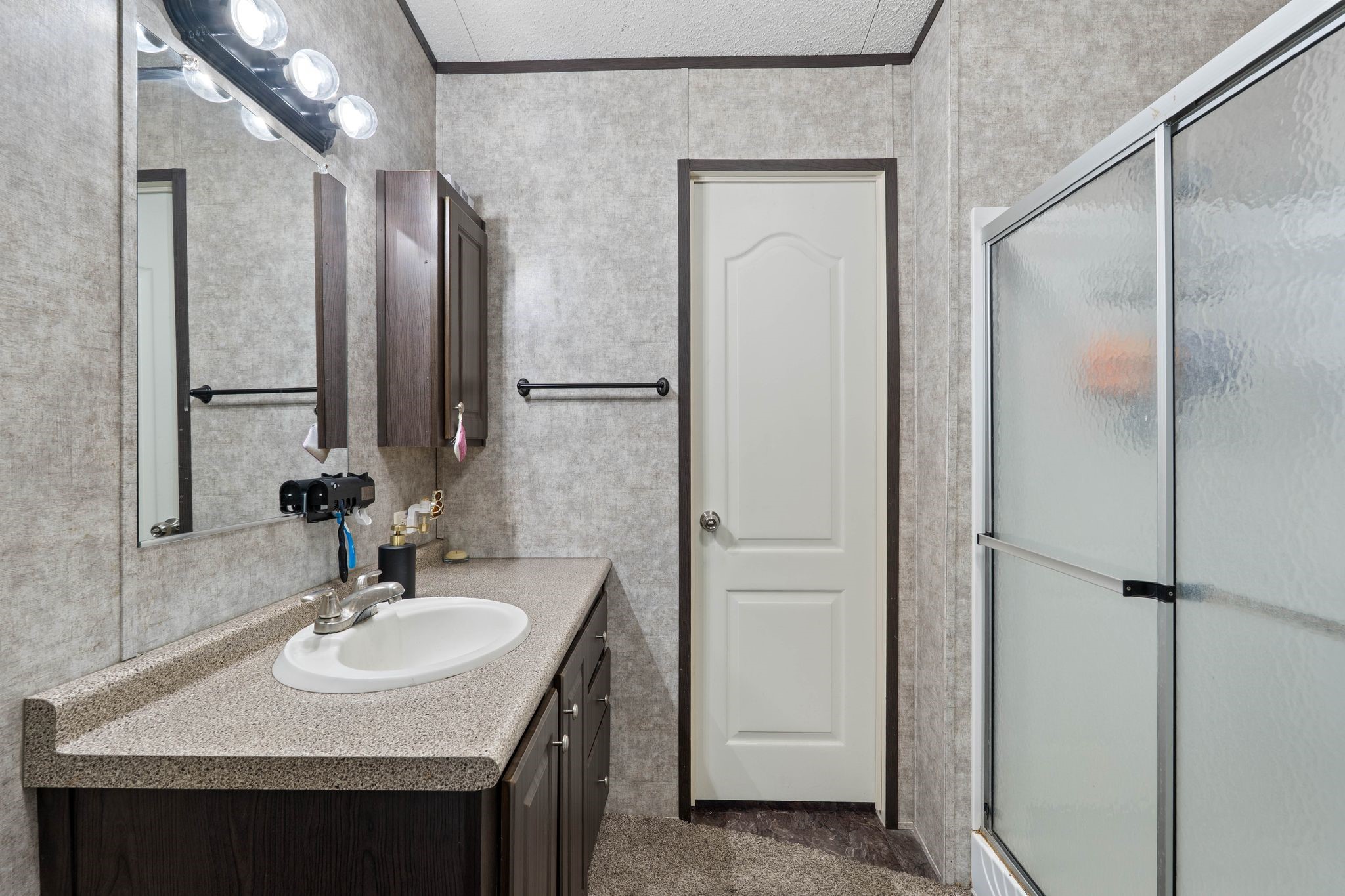 14633 Forest Tower Court Conroe, TX 77306 - Photo 14 of 25 a bathroom with a sink and a mirror