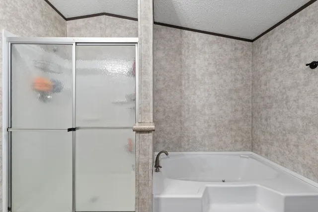 a bathroom with a bathtub and a shower