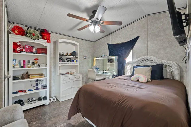 a bedroom with a bed and cabinets