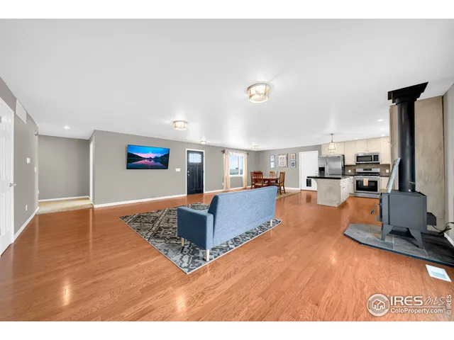 a living room with furniture and a rug